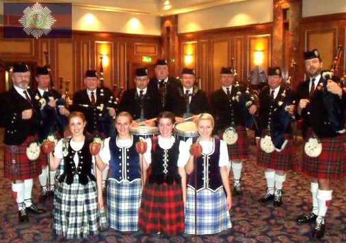 Corporate function with band members and dancers.